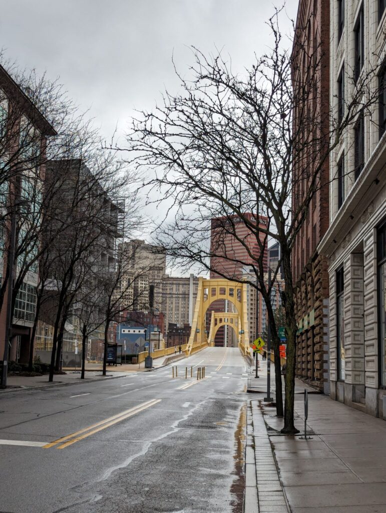 Pittsburgh's Andy Warhol Bridge, with downtown in the background and the street leading to the Andy Warhol Museum in the foreground.